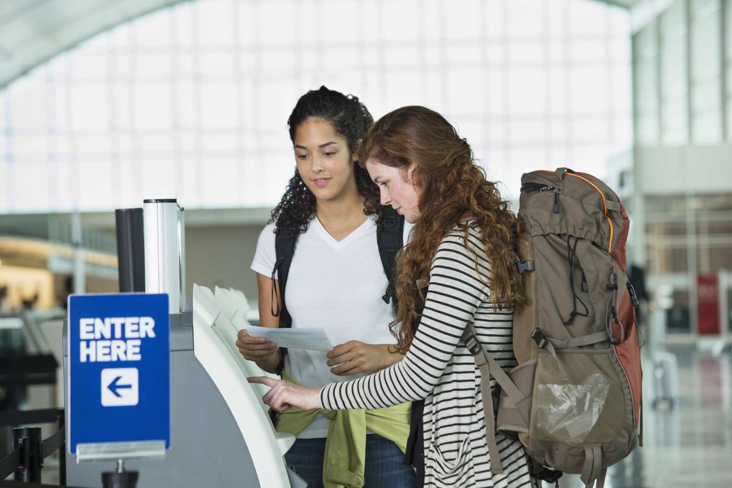 Travellers checking in at the airport